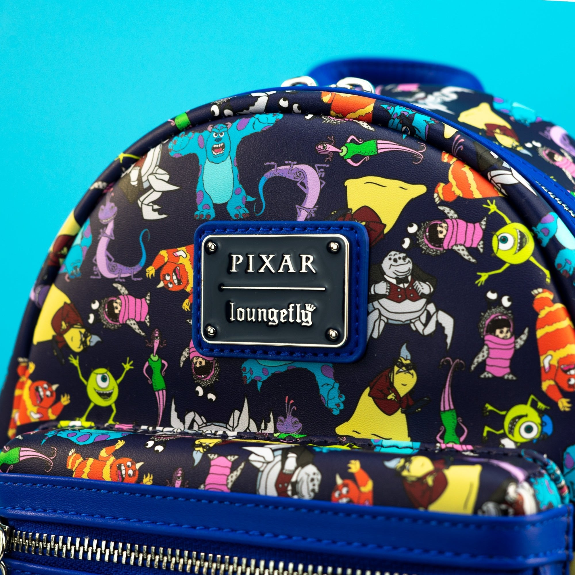 Loungefly x Disney Pixar Monsters Inc AOP Mini Backpack - GeekCore
