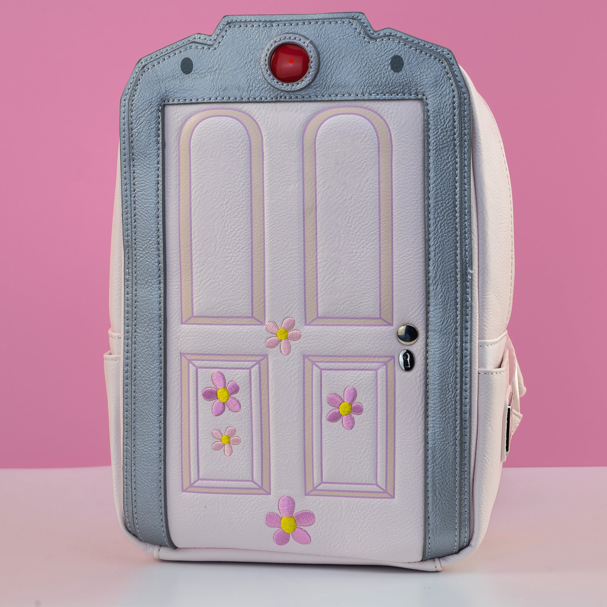 Loungefly x Disney Pixar Monsters Inc Light Up Boo's Door Mini Backpack - GeekCore